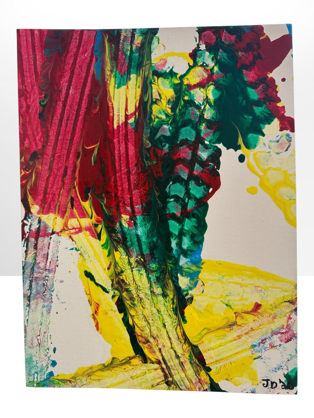 An abstract canvas painting featuring bold, textured drips and splatters of red, green, yellow, blue, and black paint on a light background, with a visible artist signature 